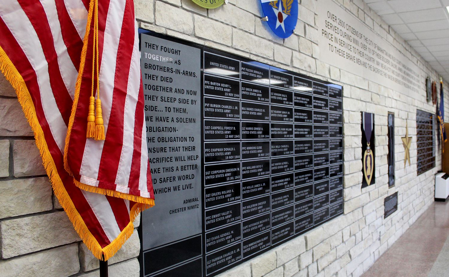 photo of the memorial wall outside Peace Memorial Auditorium